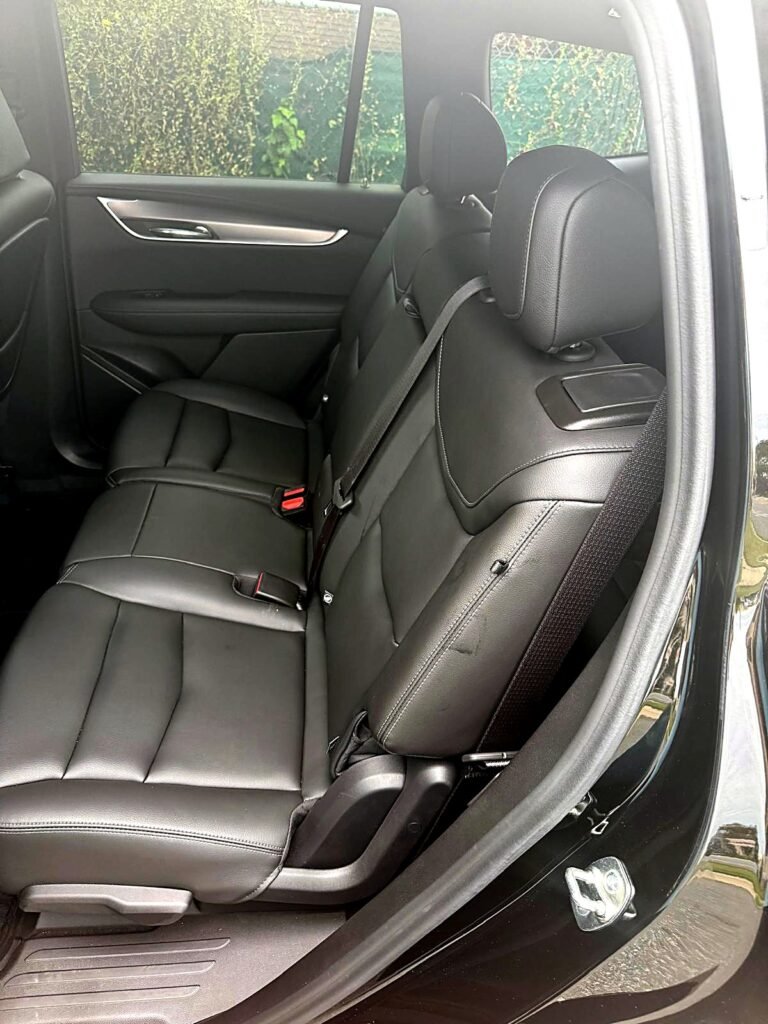 Cadillac XT6 black leather interior seating for comfortable executive and airport travel.