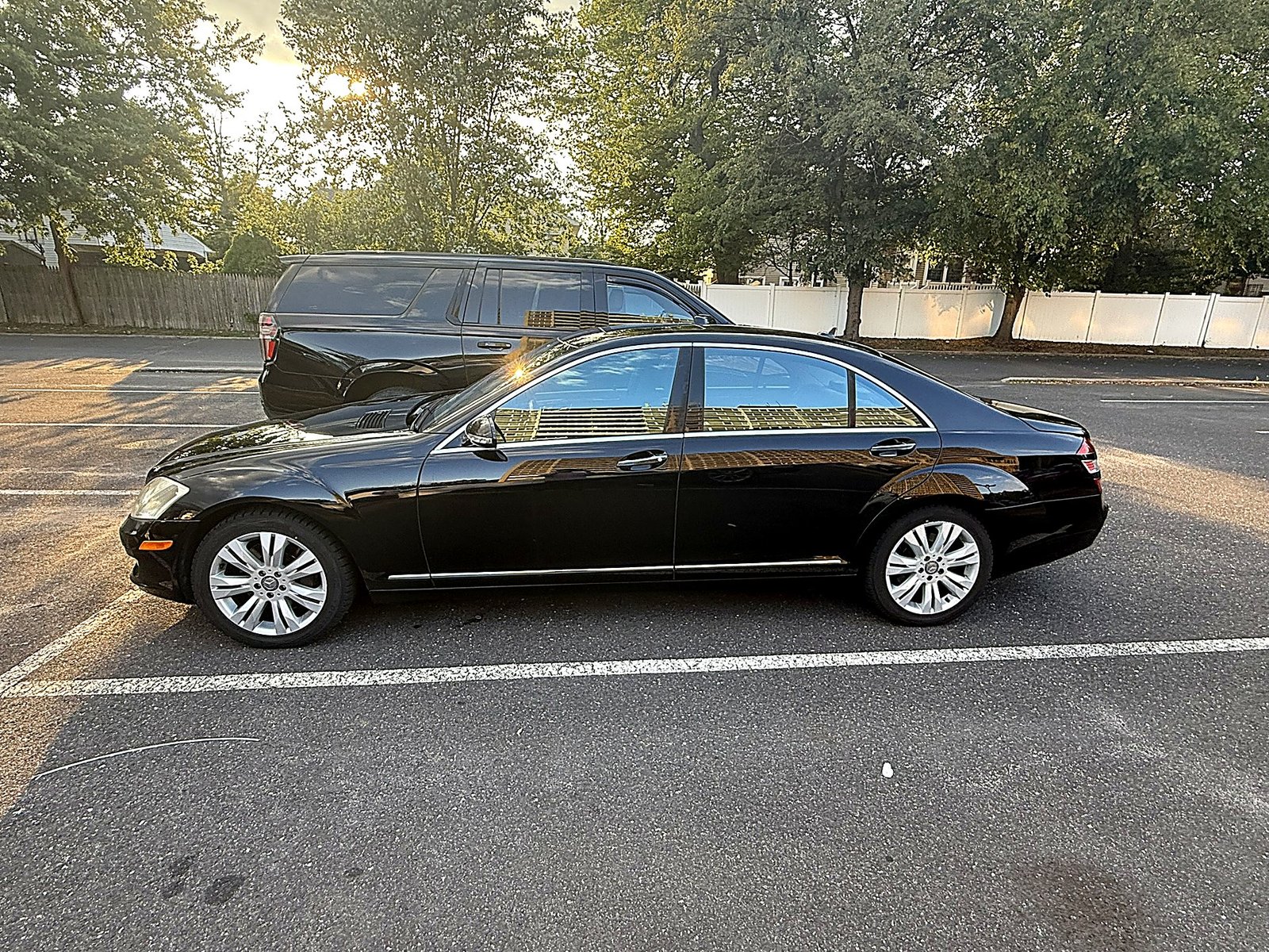 Black Mercedes sedan side profile