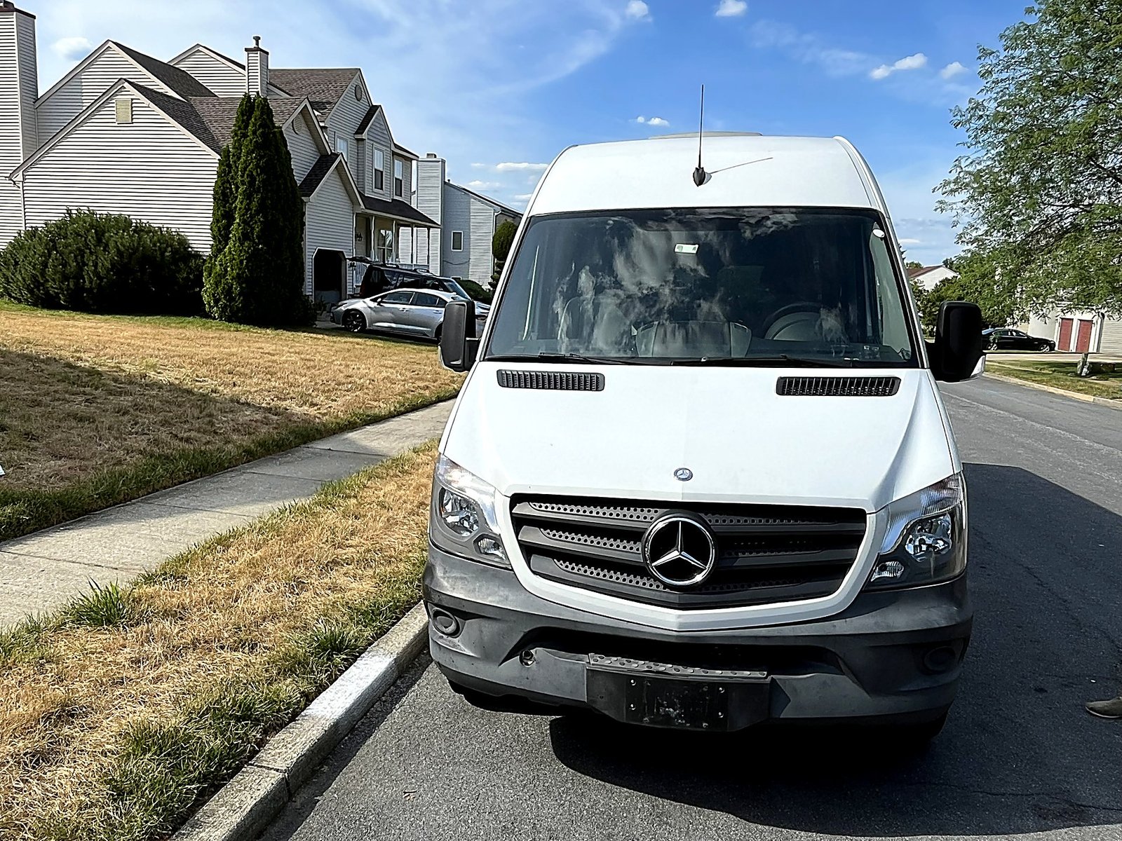 White Mercedes-Benz Sprinter van front