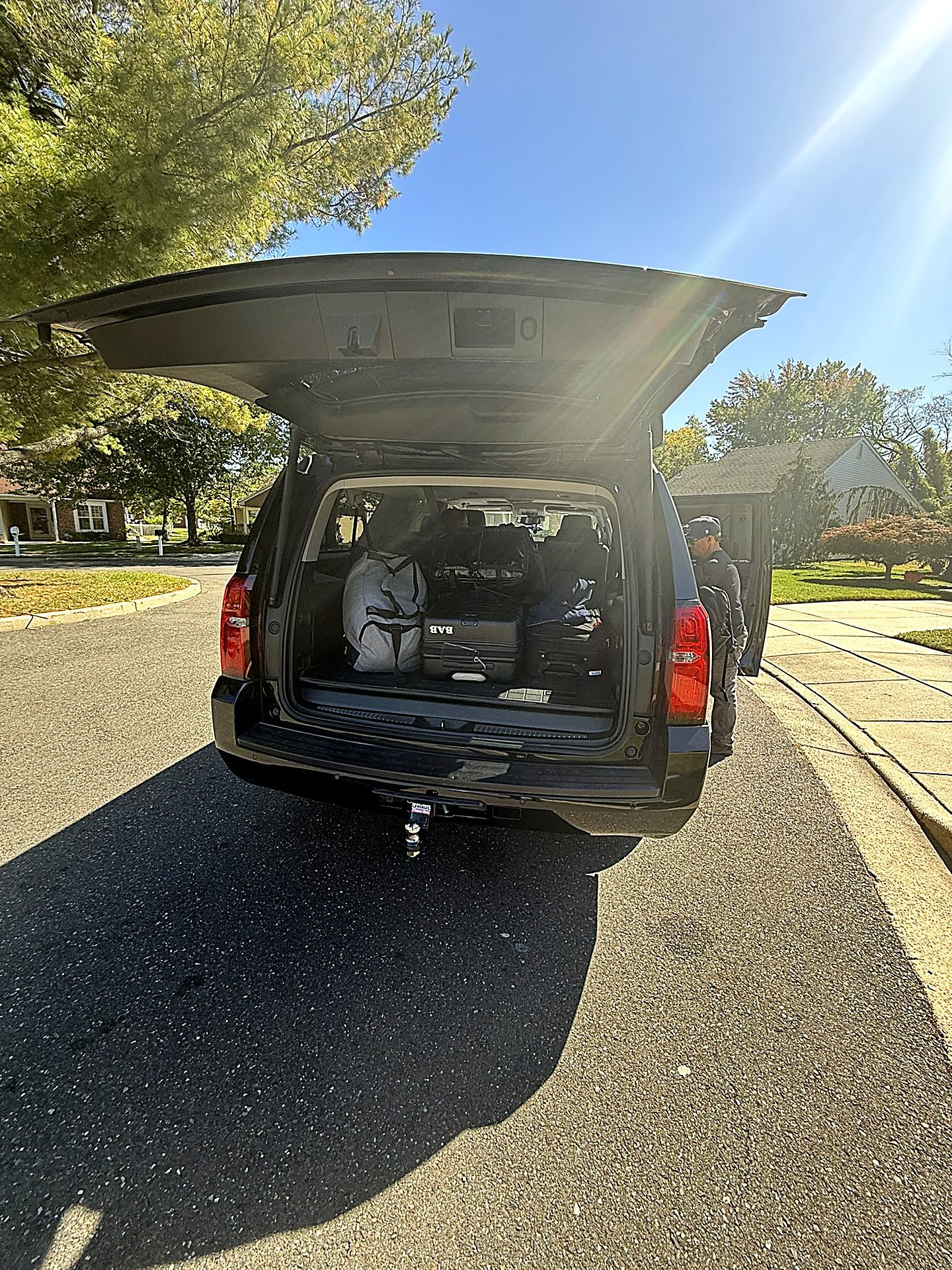 SUV rear hatch open with luggage